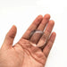 A close-up of a clear silicone protector placed on the palm of a hand, emphasizing its clarity and dimension.