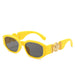 Yellow sunglasses with gold accents on the arms, showcasing the full frame and design, displayed on a white background.