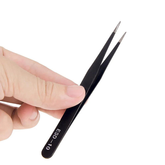 Hand holding a black ESD-10 precision tweezer.