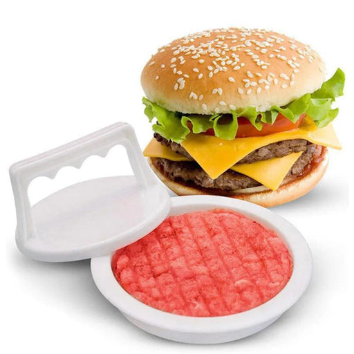 White burger press next to a formed raw patty and a finished hamburger with lettuce, cheese, and a sesame seed bun.