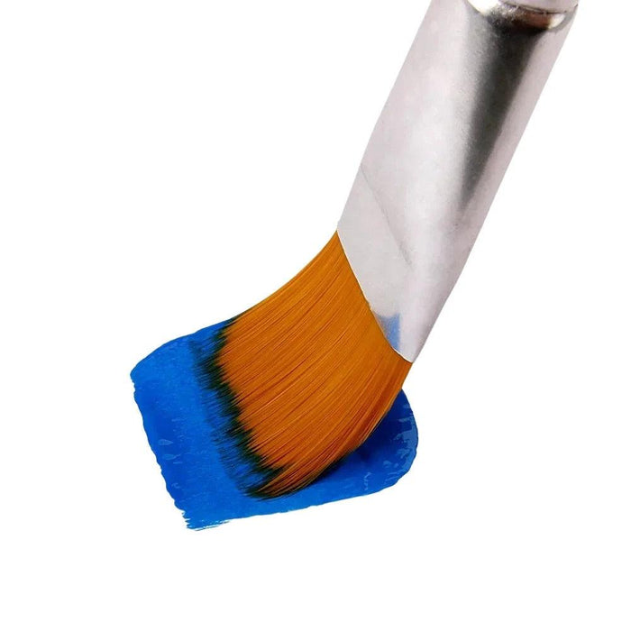 Paintbrush with orange bristles applying blue paint on a surface.