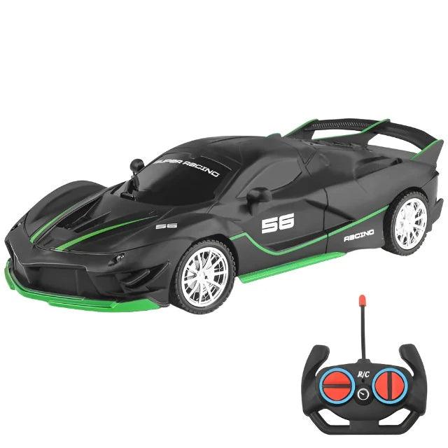 A black sports car with green accents and an accompanying remote control.