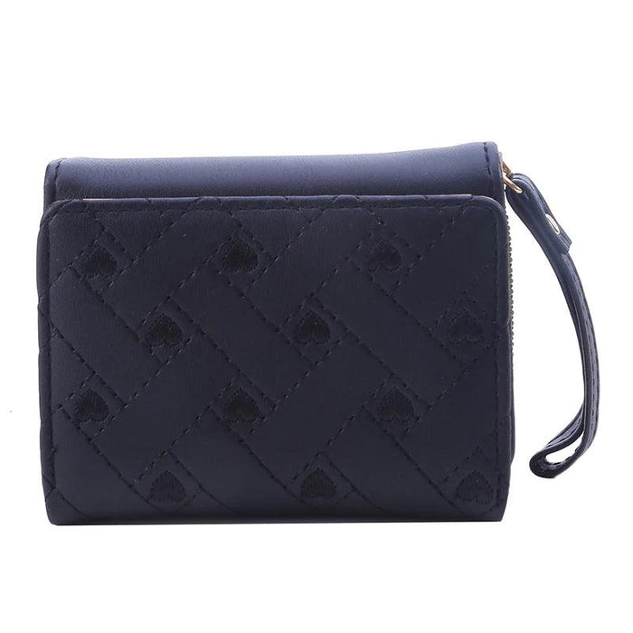 Closed black wallet with a quilted pattern, showing the front view with a wrist strap and zipper.