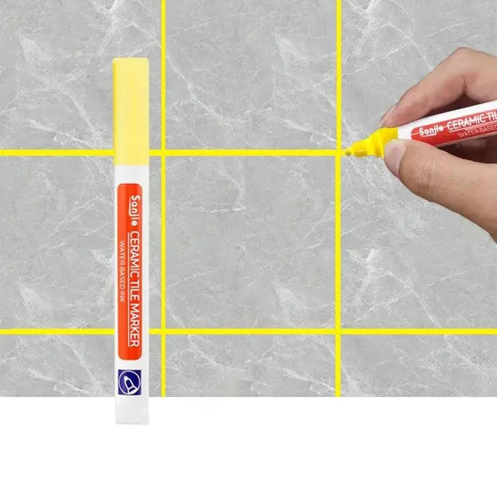 A yellow ceramic tile marker in use on a marble-like tile surface, clearly defining grout lines for a polished and clean finish.