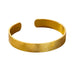 Gold bracelet with a wide, flat design and textured surface, displayed on a white background.