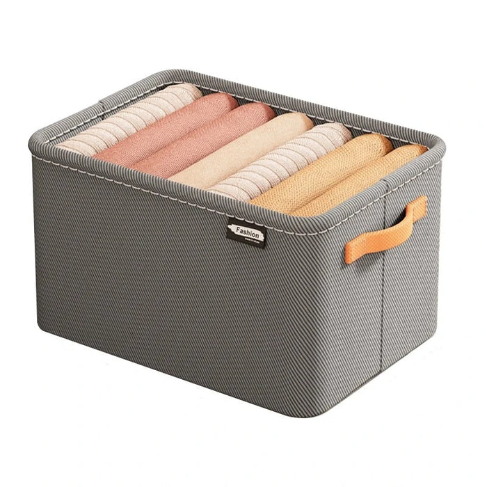 A gray organizer filled with rolled items, showcasing its neat and organized look. The organizer's label "Fashion" is visible on the front.