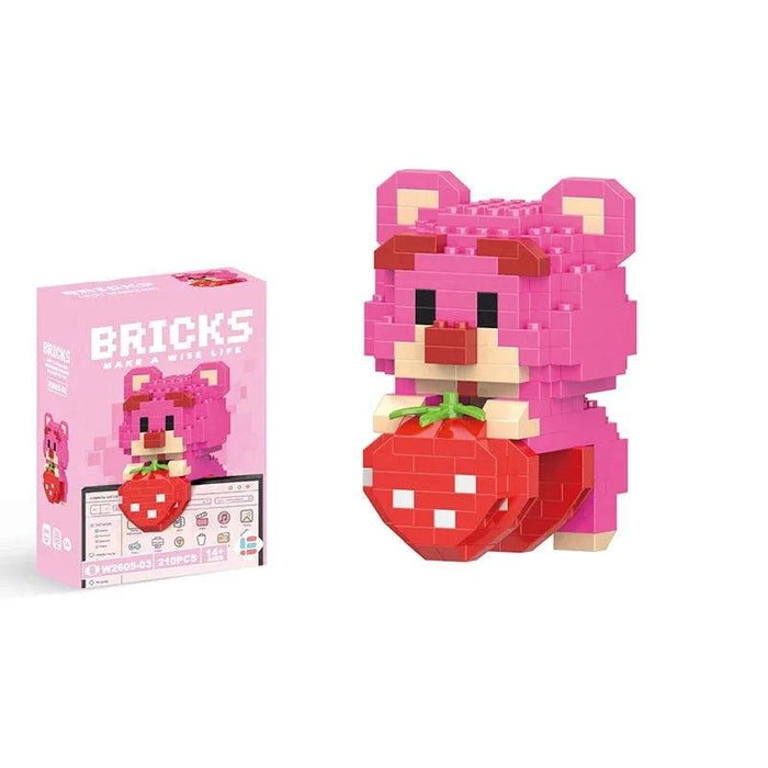 A single block-style toy figure of pink bear, along with its pink packaging box. Display on white background.