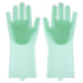 A pair of green silicone cleaning gloves with rubber bristles on the palms and fingers, displayed against a white background.