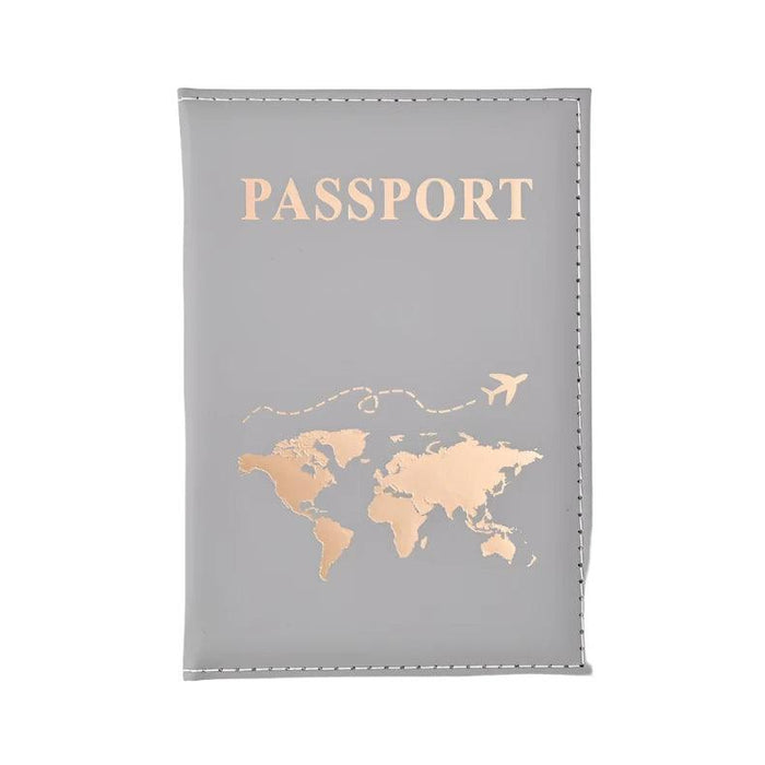 A single gray  passport holder with a gold world map design and "PASSPORT" in gold text.