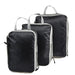 A set of three black packing cubes with light gray zippers and handles, displayed standing up in a row. Each cube has a handle at the top.