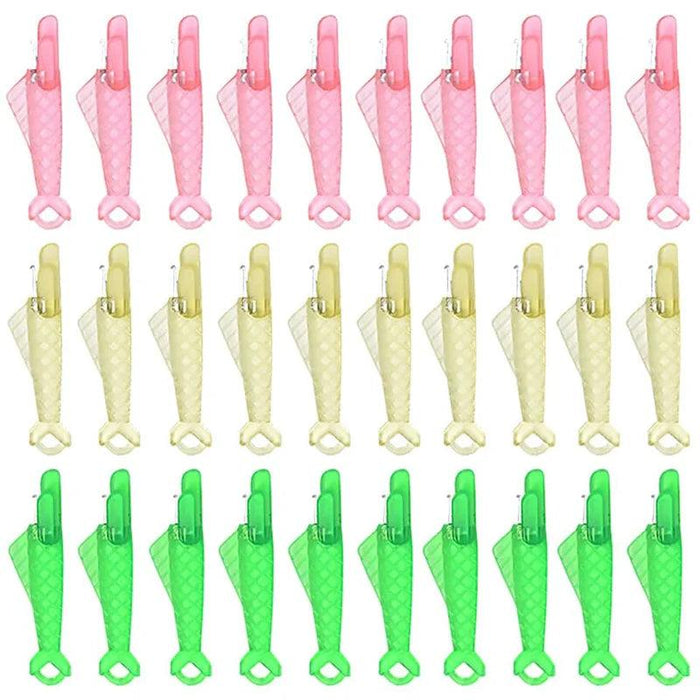 Thirty Fish Mouth Sewing Machine Needle Threaders in green yellow and pink.