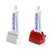 Two toothpaste squeezers with tubes, one white and one red.