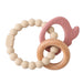 A teething ring set with cream silicone beads, a wooden ring, and a pink silicone elephant-shaped charm.