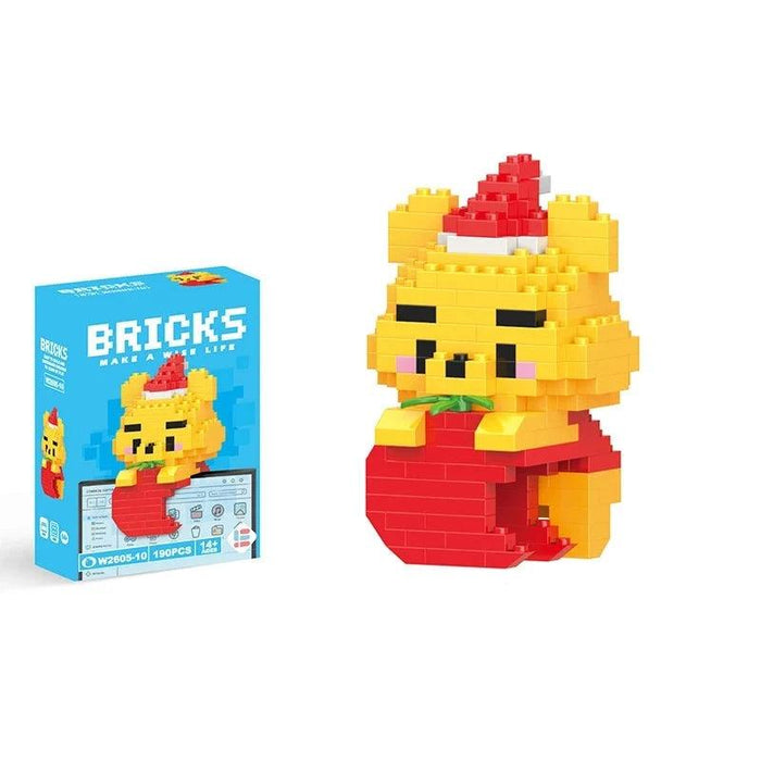 A single block-style toy figure of yellow bear, along with its blue packaging box. Display on white background.