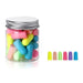 A small jar filled with Mixed-color earplugs. With 6 colorful earplugs beside it.