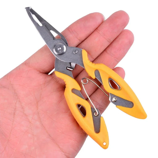 A pair of compact fishing pliers with yellow and black handles, shown in a person's hand for scale.