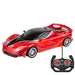 A sleek, red sports car with black accents and an accompanying remote control.