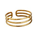 Gold cuff bracelet with three parallel bands and a hammered finish, displayed on a white background.