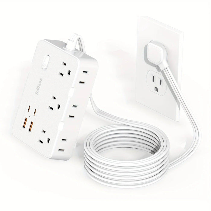 White power strip plugged into a wall socket, with a coiled white cable.