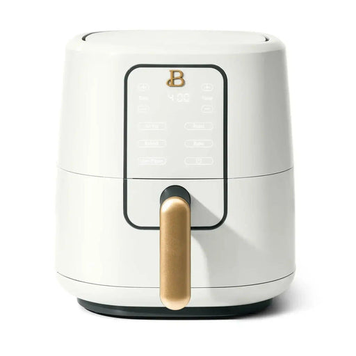 A sleek white air fryer with a gold handle, featuring a digital display and various cooking options.