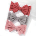 A set of 3 Baby Bow Headbands with different colors.