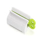 white toothpaste squeezer with a green key.