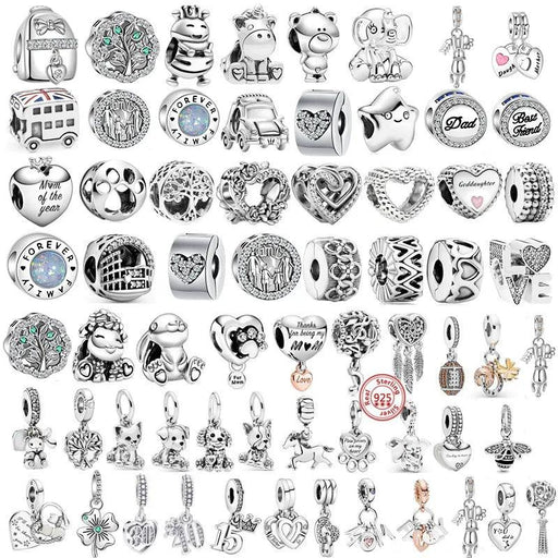 a large collection of silver charms, each with various designs and themes. The charms include shapes like hearts, animals, symbols, and words, with some adorned with gemstones or enamel detailing. They appear to be designed for bracelets, such as those used in charm bracelets, and each charm has a unique and intricate design.