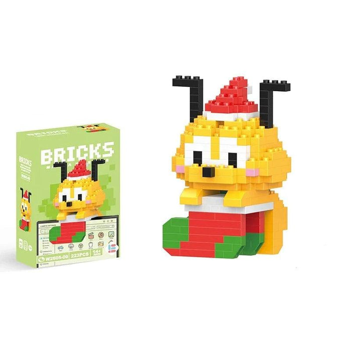 A single block-style toy figure of yellow dog, along with its green packaging box. Display on white background.