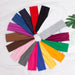 A variety of colorful fabric headbands arranged in a circular pattern.