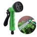 The green garden hose nozzle with a black handle, accompanied by an inset image showing the nozzle in use watering plants.