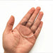 A clear silicone protector being held in a hand, showing its transparency and size.