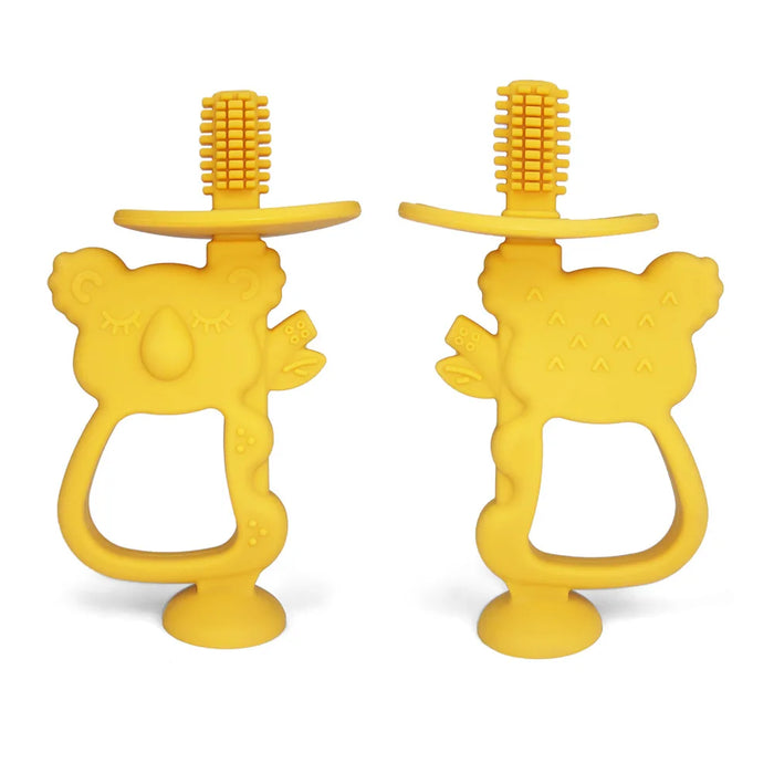 Two yellow silicone teethers shaped like koalas with built-in toothbrush bristles on top.