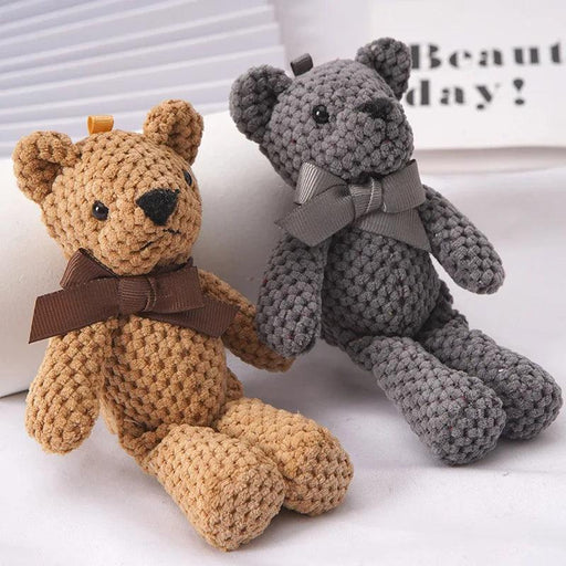 Two Plush Stuffed Bear Toys in gray and brown colors sitting together.