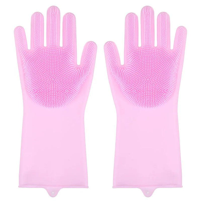 A pair of pink silicone cleaning gloves with rubber bristles on the palms and fingers, displayed against a white background.