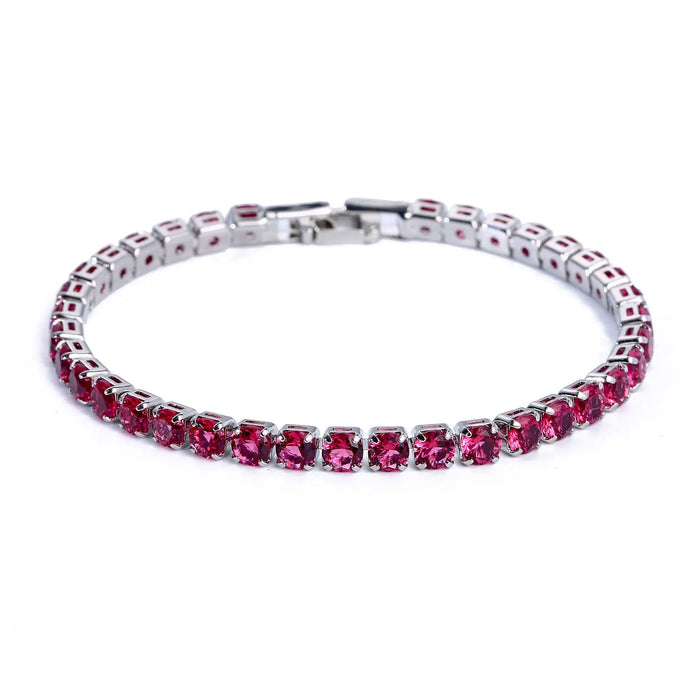 Silver tennis bracelet with pink stones on a white background.