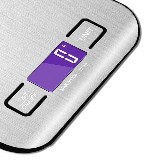 Close-up of the digital display and control buttons on a stainless steel kitchen scale, showing a purple-lit screen.