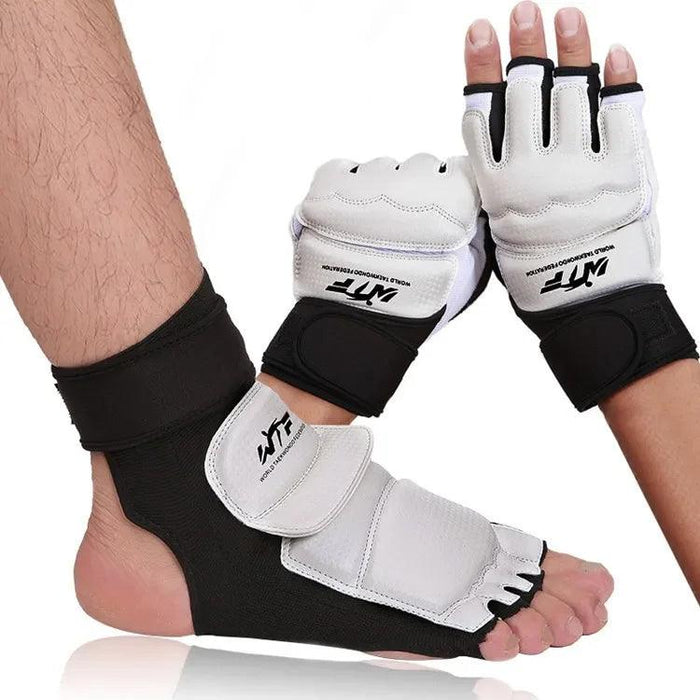 White martial arts gloves and a matching foot protector with "WTF" branding (World Taekwondo Federation), featuring black accents and Velcro straps for secure fit.