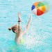 A person playing with Colorful  Inflatable Ball in the pool.