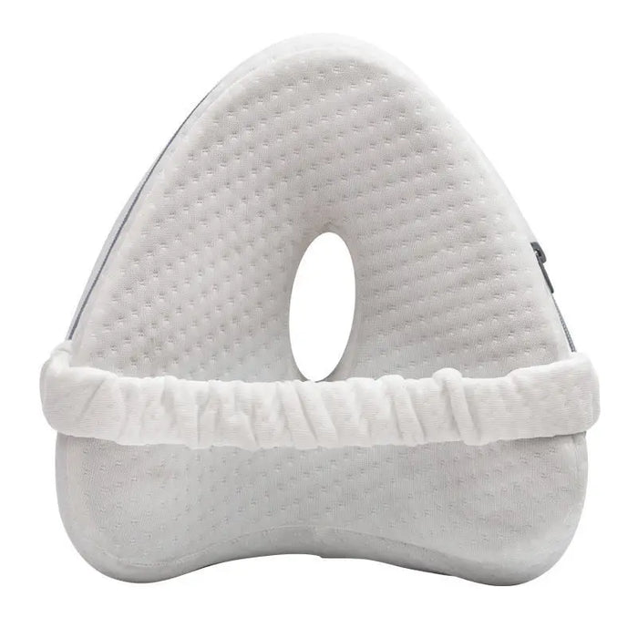 White knee pillow with a hole in the center.