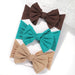 A set of 3 Baby Bow Headbands with different colors.