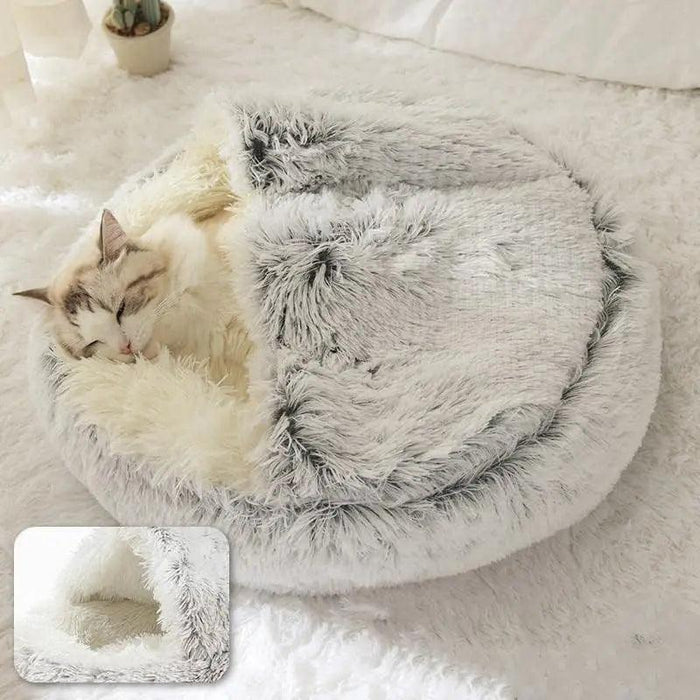 A pet bed with a partially covered top, showing a cat sleeping inside. An inset image shows a close-up of the interior.