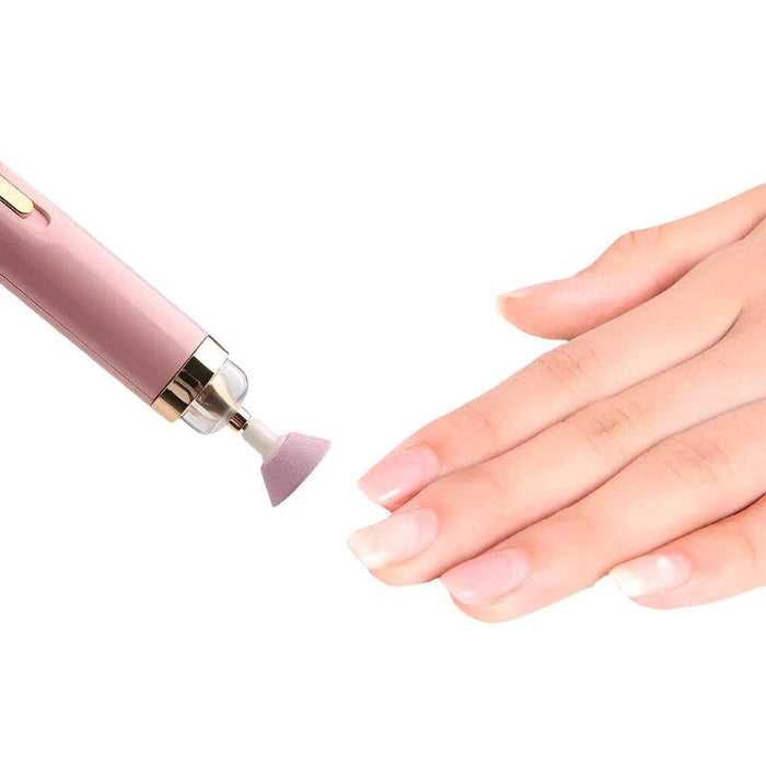 pink nail drill being used to polish nails, demonstrating its effectiveness on natural nails.