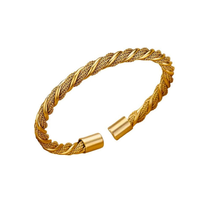 Gold braided cuff bracelet with open ends, displayed on a white background.