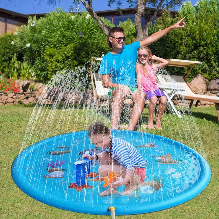 A father and daughter watch a child play on the splash mat, surrounded by water sprays in a garden.