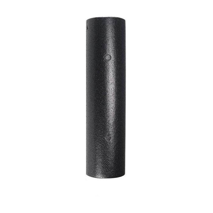 A tall, black foam roller standing upright.