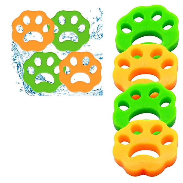 eight pet hair removers for laundry in paw-shaped designs, four green and four orange, with a splash of water in the background.