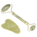 A jade roller and gua sha tool, both made from green jade stone, with golden handles.