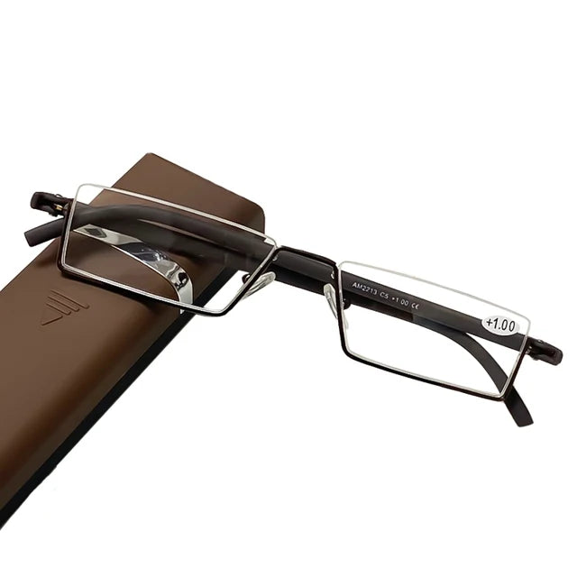 A pair of rectangular eyeglasses with thin, brown frames and clear lenses is placed on a brown eyeglass case. The background is white, highlighting the contrast between the brown frames and the clear lenses.