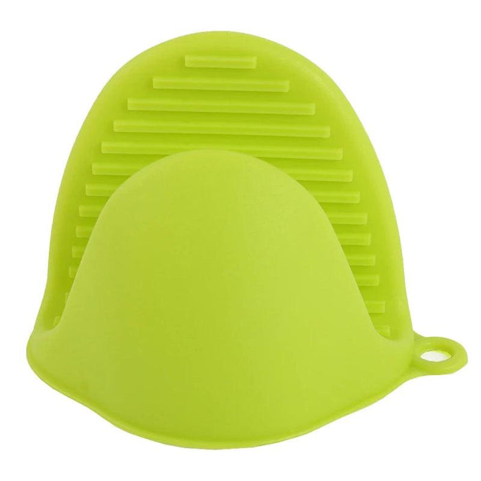 A close-up of a green silicone oven mitt with a ribbed surface for better grip.