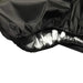 Close-up of a black fabric with elastic edges and a silver lining.